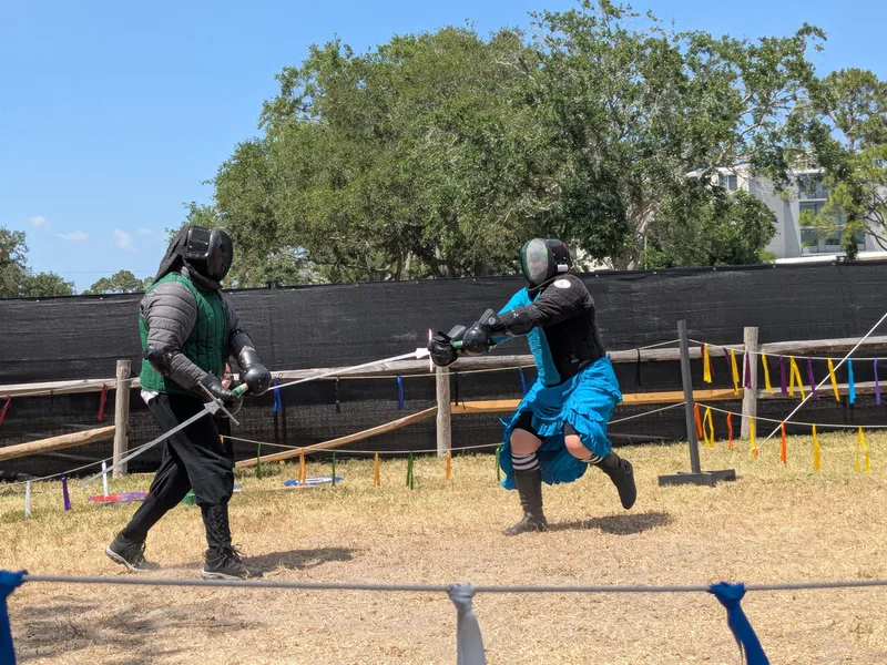 Steel Ring Academy students Peach and Garrison striking with longswords at the St Peterburg Renaissance Faire.