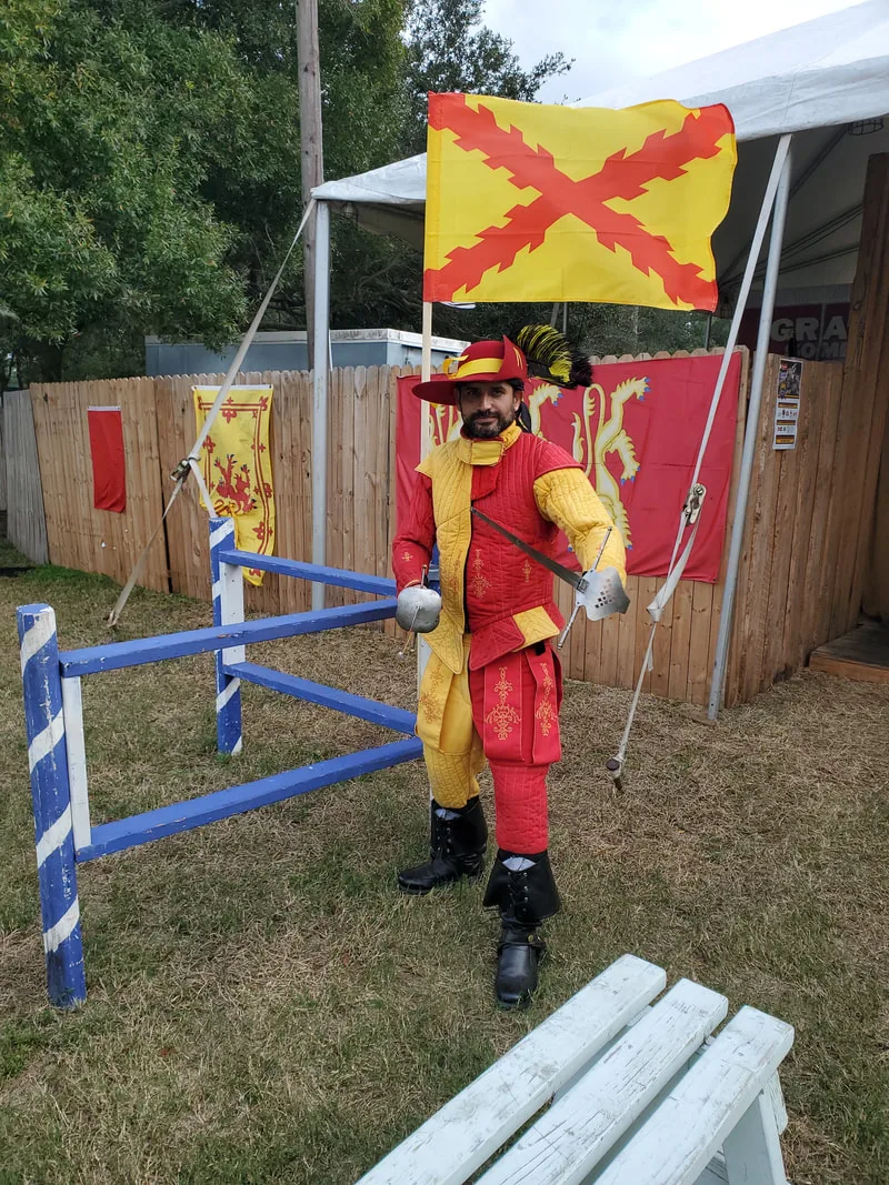 Student Joe poses with two swords at the Suncoast Renaissance Festival.
