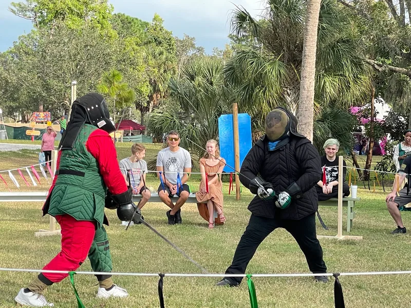 Steel Ring Academy students fighting with longswords at the Suncoast Renaissance Festival.