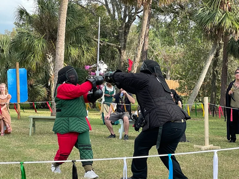 Steel Ring Academy students Billy and Aaron fighting with longswords at the Suncoast Renaissance Festival.