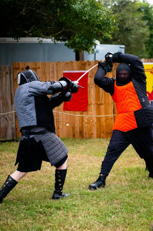 Two Steel Ring Academy students during a longsword fight at the Suncoast Renaissance Festival.