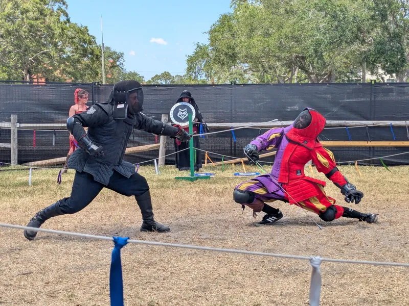 Steel Ring Academy instructor Jason and student Galloway fighting with sabers at the St Peterburg Renaissance Faire.