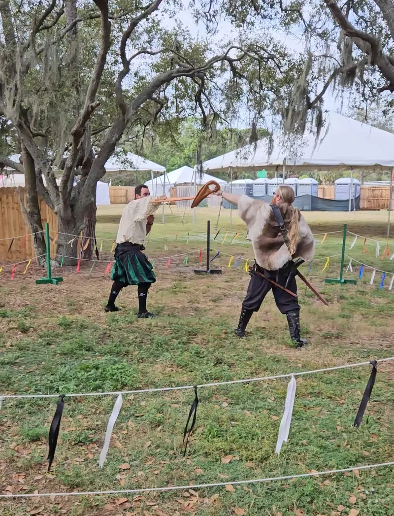 Instructors Jason and Chris drilling with leather dussack trainers at the Suncoast Renaissance Festival.